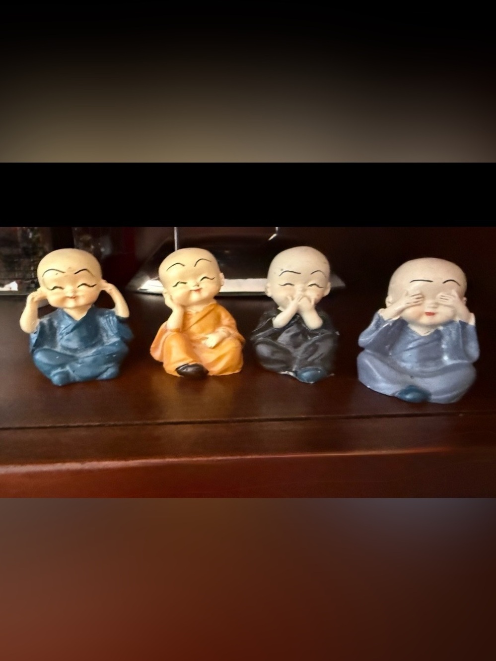 Decorative Four-Piece Monk Figurine Set — Orange, Blue, Black, Light Blue